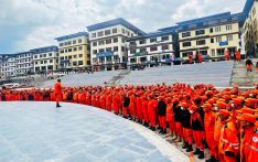 Volunteers in orange descend for clean and green Bhutan