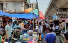 Bangabazar traders selling clothes from makeshift shops on the road