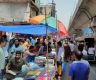 Bangabazar traders selling clothes from makeshift shops on the road