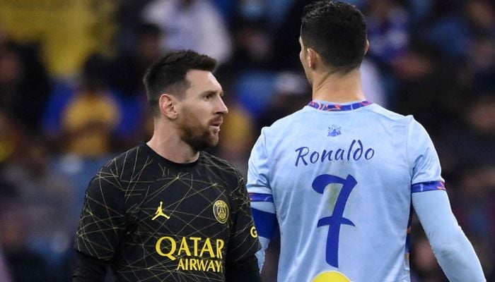 This photo shows Paris Saint-Germains (PSG) Argentine forward Lionel Messi (L) walks past Riyadh All-Stars Portuguese forward Cristiano Ronaldo (R) during a Riyadh Season Cup football match. — AFP/File