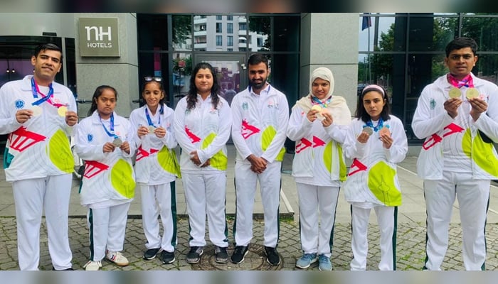 Pakistans cycling team poses with the medals they have won. — Special Olympics Pakistan