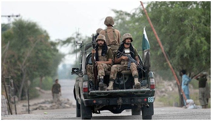 Pakistan Army personnel travelling in a military vehicle. — Reuters/File