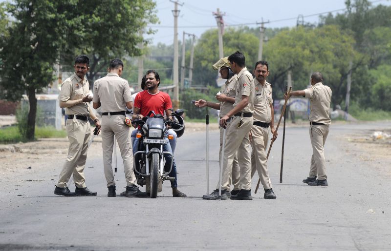 Haryana Police conduct checks near Nuh Chowk on August 1, 2023 in Gurugram, India. 