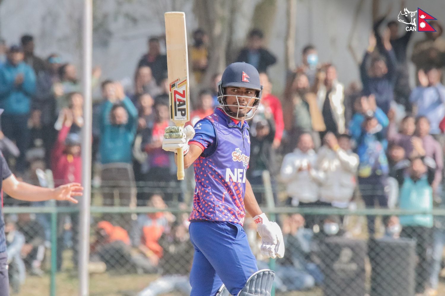 Rohit-Paudel-raises-bat-after-scoring-his-sixth-OD