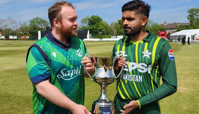 Ireland captain Paul Stirling (left) with Pakistan skipper Babar Azam. — PCB