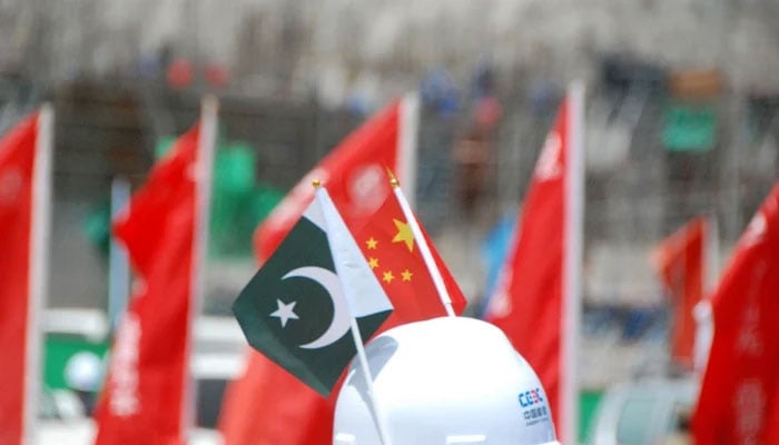 Pakistan and China flags can be seen in this image. — Xinhua/File