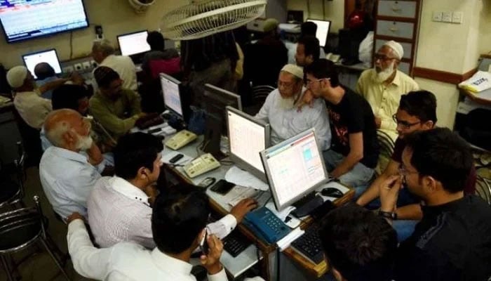 A representational image showing several employees in an office. — AFP/File