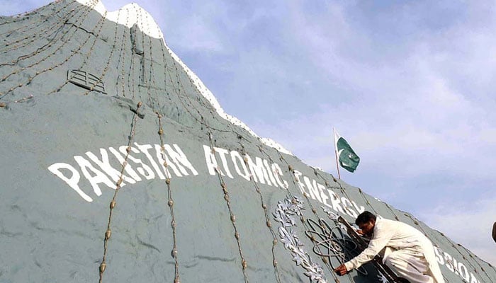 A view of replica of Chaghi Mountain at Faizabad Interchange being decorated with lights to mark the Youm-e-Takbeer. — APP/File