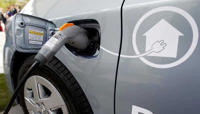 In this April 2010 photo, an electric wire is plugged into a Toyota Prius Plug-in hybrid car during a media presentation in Strasbourg. — Agencies/file