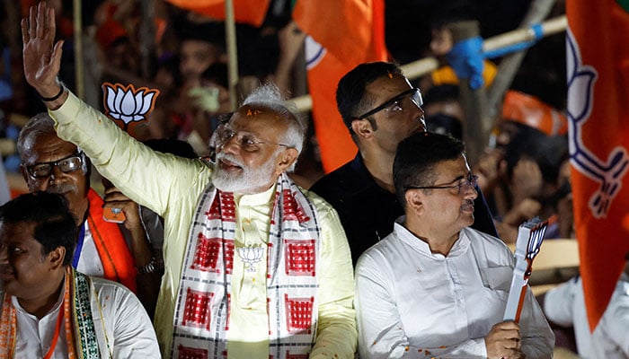 Indias Prime Minister Narendra Modi waves towards his supporters during a roadshow as part of an election campaign in Kolkata, India on May 28, 2024. — Reuters