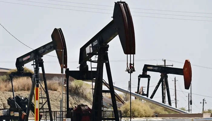 Working oil pumpjacks are pictured on the outskirts of Taft, Kern County, California on September 21, 2023. — AFP