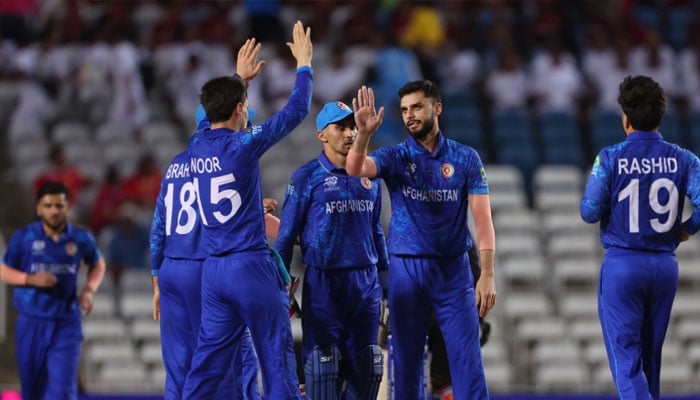 Afghan players celebrating after taking a wicket against Papua New Guinea in this image from June 14, 2024.— X@ESPNCricInfo