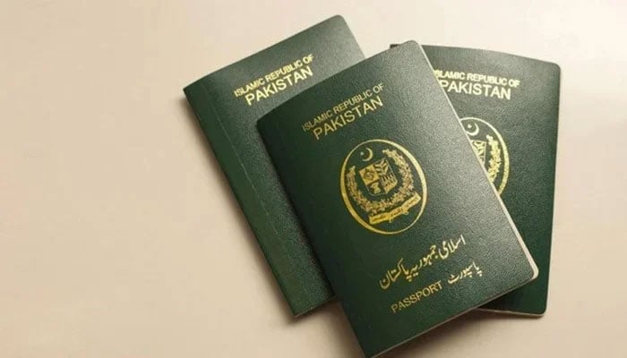 This photograph shows three books of Pakistani passports. — AFP/file