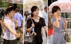 韩媒：韩国人为何爱打遮阳伞