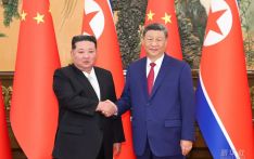 习近平同金正恩举行会谈