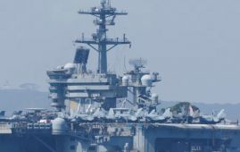 US carrier shoots down Iranian drone as tensions escalate and diplomatic talks hit a snag