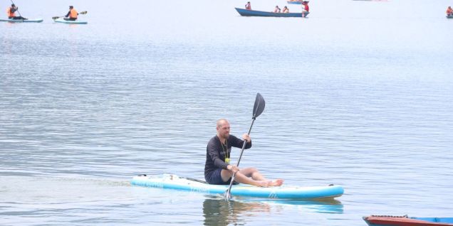 Tourists enjoy boating in Phewa Lake